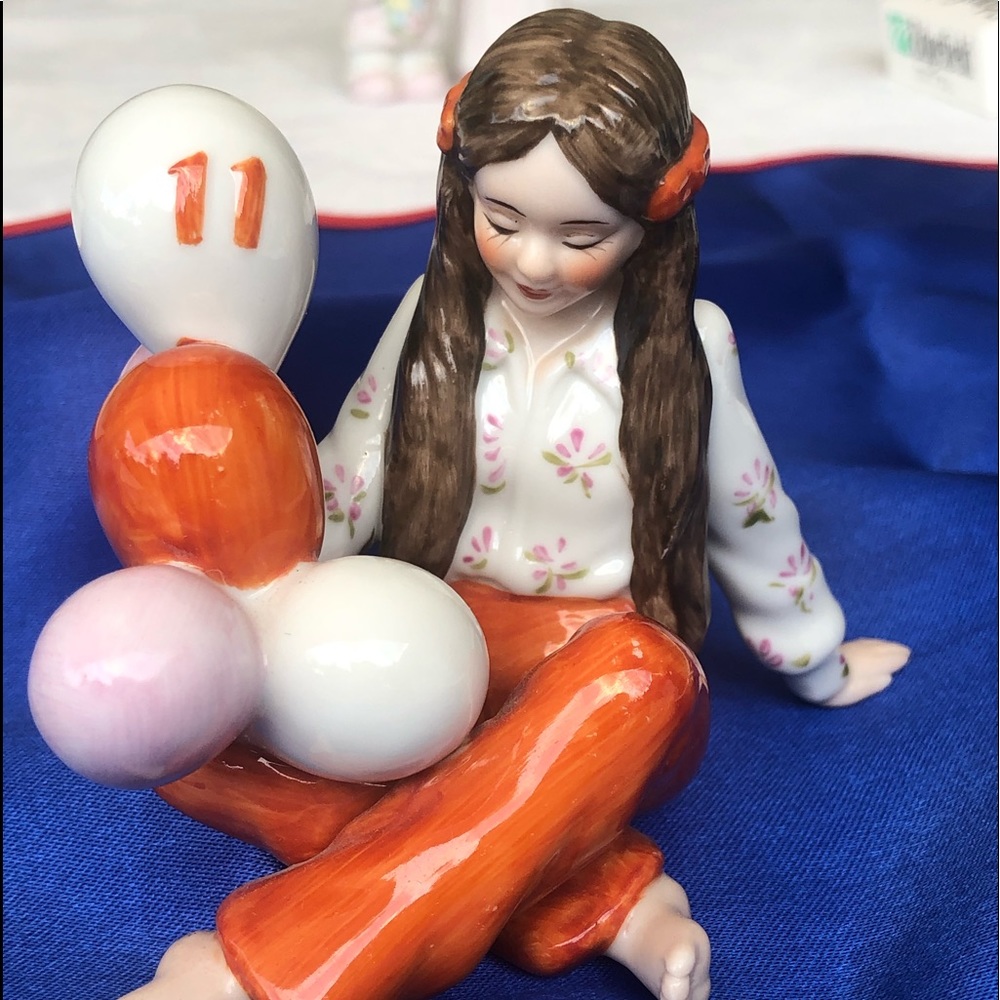Vintage girl holding balloons for 11th Birthday